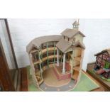 A wooden model of Shakespeare's Globe Theatre, in fitted wooden case, and a Thatched Dolls house