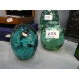 Two Victorian green glass dump paperweights