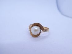 Pretty yellow metal dress ring set with single pearl in crossover design mount, marks worn, size O,