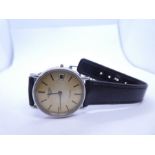 Longines; a stainless steel Longines wristwatch on black leather strap