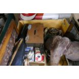 Two boxes of sundry including coins and a fibreglass Castrol sign