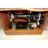 An old Excelsior sewing machine in fitted case