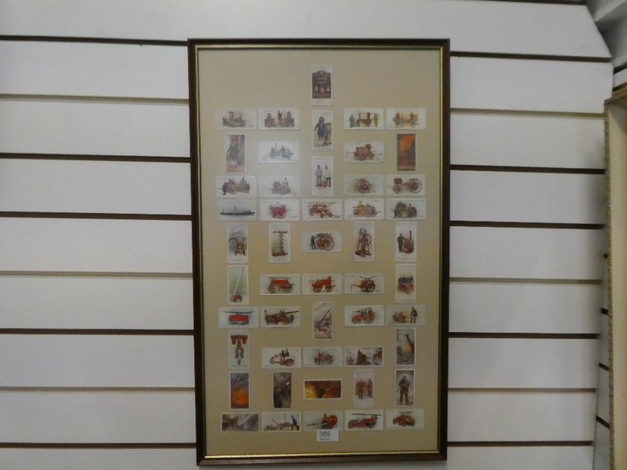 A framed display of Players cigarette cards depicting firefighters and fire engines