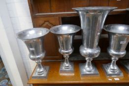 A quantity of polished aluminium urns (7)