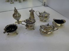 A quantity of silver salts and peppers, having various hallmarks, designs and patterns, Decorative d
