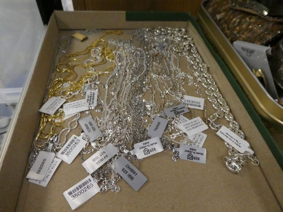 A tray of modern silver necklaces and chains