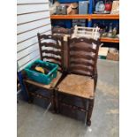 A set of 6 reproduction ladder back chairs having rush seats