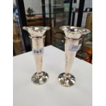 William Comyns and Sons, an Art Nouveau pair of Edwardian silver tapering bases with flared, petal r
