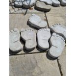 Six stepping stones in the shape of feet
