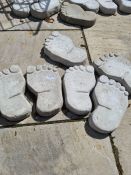 Six stepping stones in the shape of feet