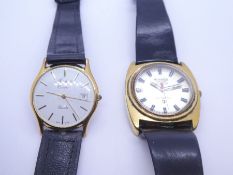 Two vintage gents wristwatches a Roamer Micro Quartz and a Mitchells Exeter example, both on black s