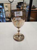 A silver Victorian goblet by Richards and Brown, having engraved decoration and beaded borders. With