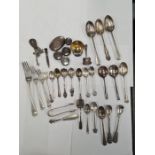 A quantity of silver flatware with a very few items of white metal. Mainly silver to include spoons,