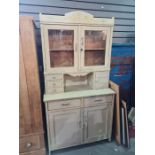 A painted pine kitchen dresser having glazed back