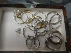 A quantity of modern silver dress rings set with cubic zirconia and swarovski crystals