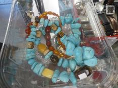 Large strand of unfashioned turquoise, tiger's eye, etc, faceted amber beads, etc