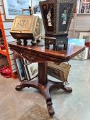 A Victorian Rosewood foldover card table on central pillar and spread base