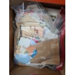 A box of World stamps in albums and bag of Kiloware