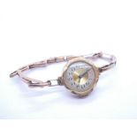 Antique 9ct yellow gold wristwatch with circular dial, marked 375 on 9ct yellow gold adjustable stra