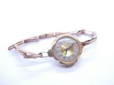 Antique 9ct yellow gold wristwatch with circular dial, marked 375 on 9ct yellow gold adjustable stra