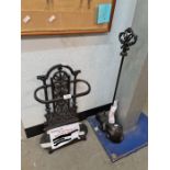 A reproduction Victorian style umbrella stand and a door stop in form of cat