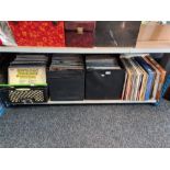 A shelf of vinyl LP records, mixed genres