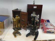 An antique brass microscope by R & J Beck, London No. 27884 in mahogany fitted case and one other la