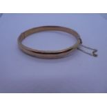 9ct yellow gold bangle, marked 375, Birmingham, maker S & P, 6cm diameter, with safety chain, approx