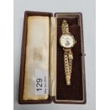 Shierwater & Lloyd; a vintage Schierwater & Lloyd gold cased wristwatch with silvered dial and subsi