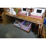 A Victorian mahogany extending dining table with two small leaves on reeded legs