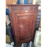 A 19th Century mahogany hanging wall cupboard having 3 small drawers with inlaid decoration