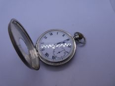 Hallmarked silver cased half hunter pocket watch with white enamel dial, subsidiary seconds dial and