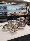 A high quality silver tea service by Walker and Hall, Sheffield 1958 - 1960. Of heavy design, circul