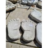 Six stepping stones in the shape of feet