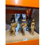 Three figures of soldiers by Peter Hicks and three metal figures of oriental ladies