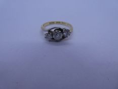 18ct and platinum mounted crossover design diamond trilogy ring, central stone approx 0.25 carat, ma