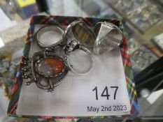Four silver rings to include Lapis and Moonstone tiger's eye ring etc and an agate set white metal b