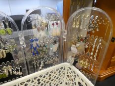 Tray costume jewellery containing earrings, silver rings, bracelets, etc. And an earring stand hung