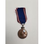 A King's medal with ribbon