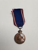 A King's medal with ribbon