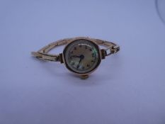 Antique 9ct gold cased ladies watch with Mother of Pearl dial and numbers, case marked 375, 95667, m