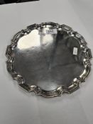 A silver tray of circular form having decorative raised border. Hallmarked Birmingham 1935 Cohen and