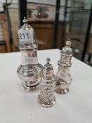 A silver sugar sifter, hallmarked Chester 1924 AF, maker's mark worn. With two other examples for pe
