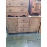A modern oak French style sideboard having 3 central drawers
