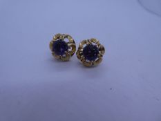 Pair of 18ct yellow gold floral design earrings each set round cut amethyst, both butterfly backs pr