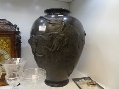 A large oriental bronze vase probably Japanese having raised decoration of Elephants, signed to base