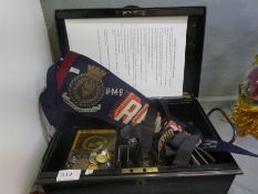 Of World War II interest; a black tin containing HMS Renown Pennant, HMS Ark Royal Cap ribbon and Ma