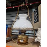 A Hinks brass hanging oil lamp with opaline shade