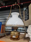 A Hinks brass hanging oil lamp with opaline shade