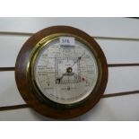 A short and Mason Stormoguide Barometer, in inlaid mahogany case